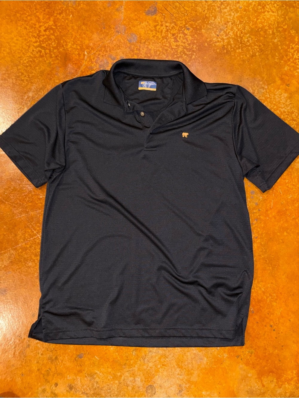 Jack Nicholas Black Polo with Small Gold Bear Accent